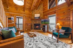 Catch your favorite view from the living room, whether it's the mountains, wood burning fireplace, or your favorite show.