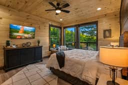This room features room darkening dark gray blinds and a comfortable king bed to ensure a good sleep