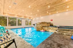 This large pool is set up for all to enjoy! The main pool area is 4ft deep and features a large sun ledge for lounging that is 9 inches.  The upper level is a 1ft deep kiddie pool.