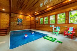 Private indoor pool with cozy wood interiors and fun family-friendly games
