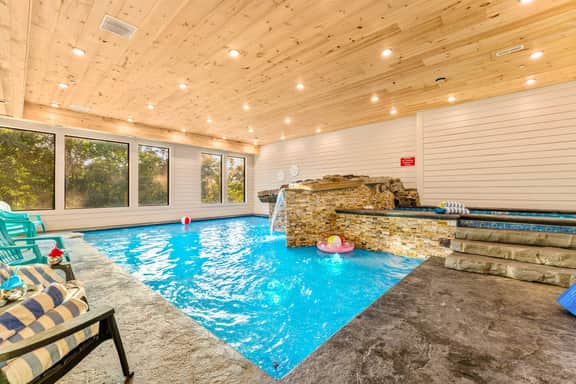 This large pool is set up for all to enjoy! The main pool area is 4ft deep and features a large sun ledge for lounging that is 9 inches.  The upper level is a 1ft deep kiddie pool.