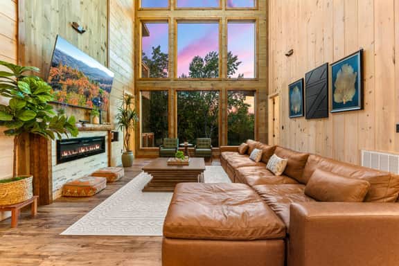 This large living room is cozy for all to gather and make memories! This room features large screen tv, queen murphy bed, XBOX360, and board games.